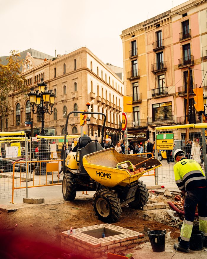 Vibrant cityscape showing construction site activity in Barcelona's urban area.